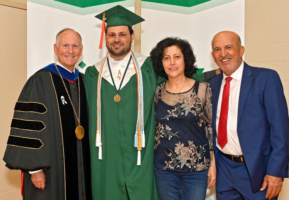 Scholar Mohran Al Jurdi with the Chancellor of UNC Charlotte at his graduation